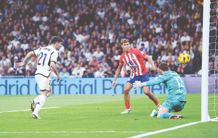 REAL Madrid&rsquo;s Brahim Diaz (L) scores against Atletico Madrid during their La Liga match at Santiago Bernabeu.&mdash;Reuters