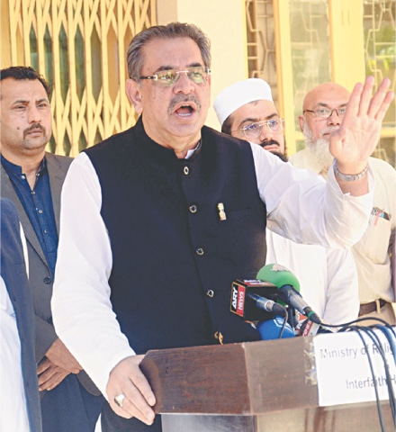 Caretaker Federal Minister Aneeq Ahmed speaks to the media.&mdash;APP