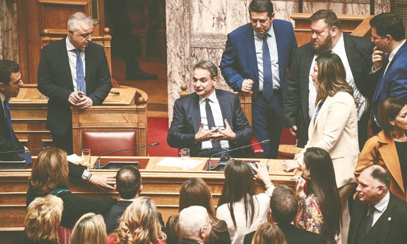 Prime Minister Kyriakos Mitsotakis (centre) attends the vote on same-sex marriage in the Greek parliament.&mdash;AFP