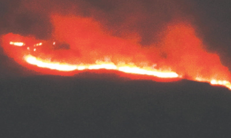 A view of fire in Mirkheli area of Kohat. &mdash; Dawn