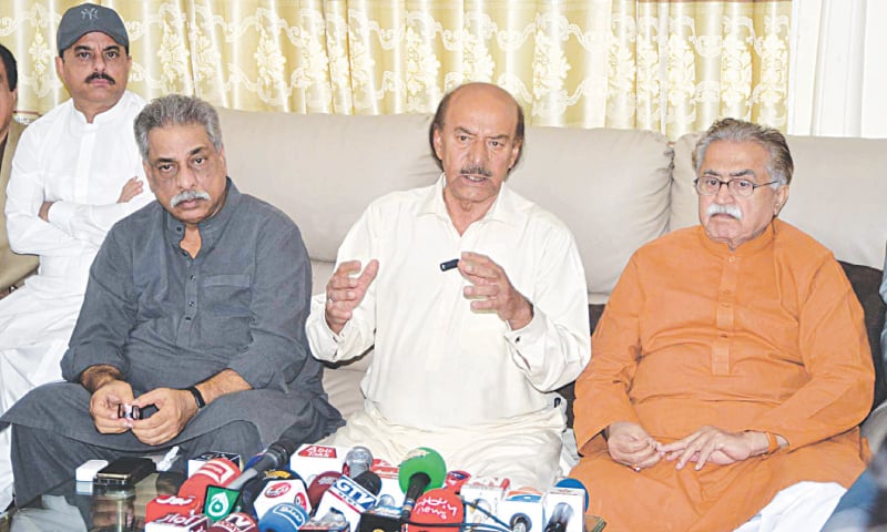 PPP leader Nisar Ahmed Khuhro (centre) speaks at a press conference on Saturday.—Dawn PPP leader Nisar Ahmed Khuhro (centre) speaks at a press conference on Saturday.—Dawn