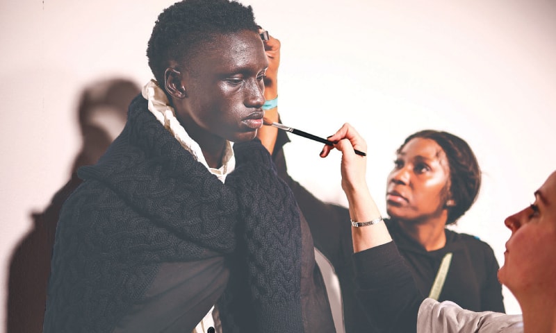 LONDON: A model is being prepared back-stage for a catwalk presentation by Irish designer Robyn Lynch during London Fashion Week, on Saturday.&mdash;AFP