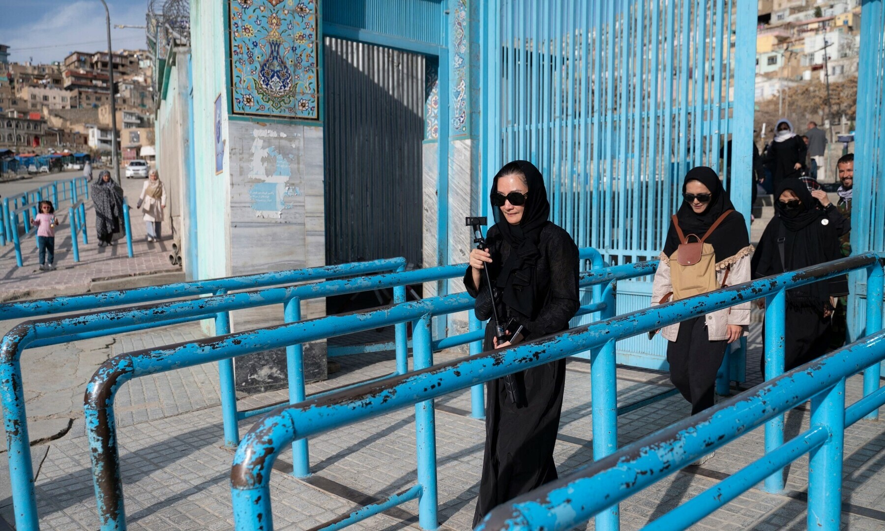In this picture taken on March 25, Thai tourists leave after visiting the Kart-e-Sakhi Shrine in Kabul. — AFP