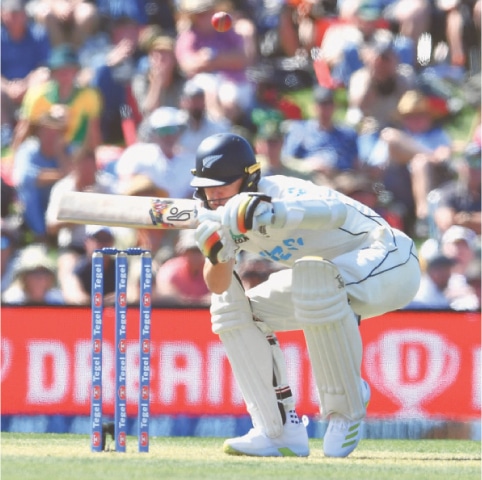NEW ZEALAND batter Matt Henry ducks under a bouncer during the second Test against Australia at Hagley Oval on Friday.—AFP