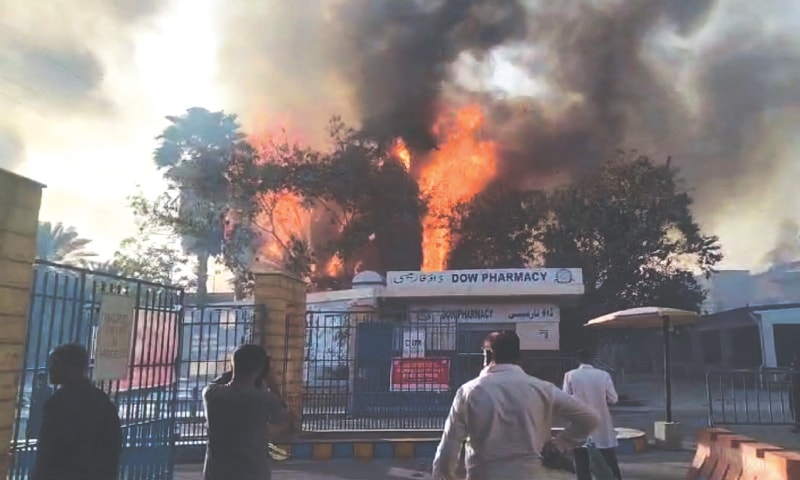 Flames rise after bushes caught fire on Dow University of Health Sciences, Ojha campus.&mdash; Shakil Adil / White Star