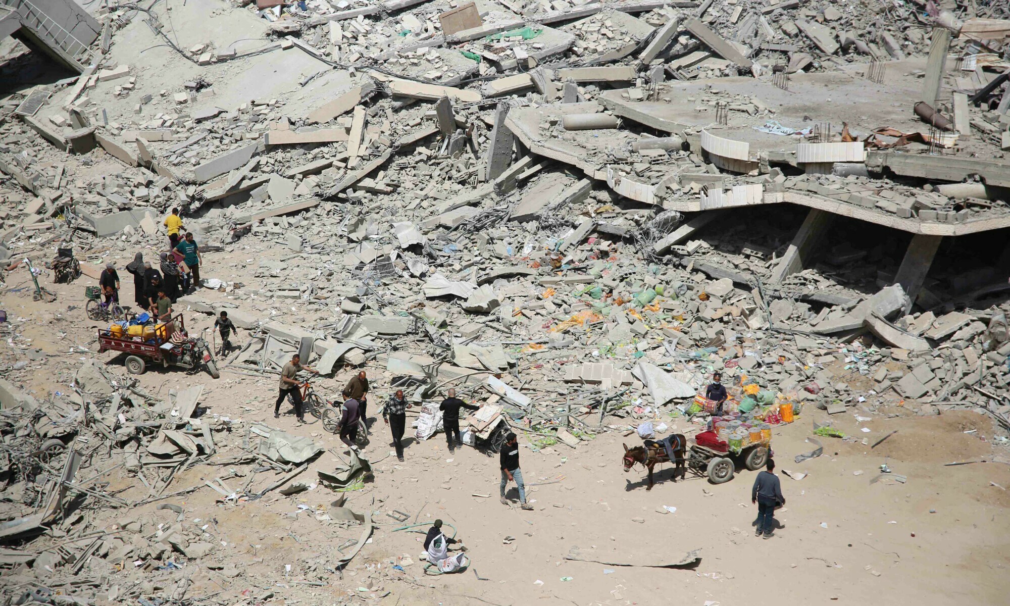 Palestinians inspect the damage in the area around Gaza’s Al-Shifa hospital after the Israeli military withdrew on April 1. — AFP