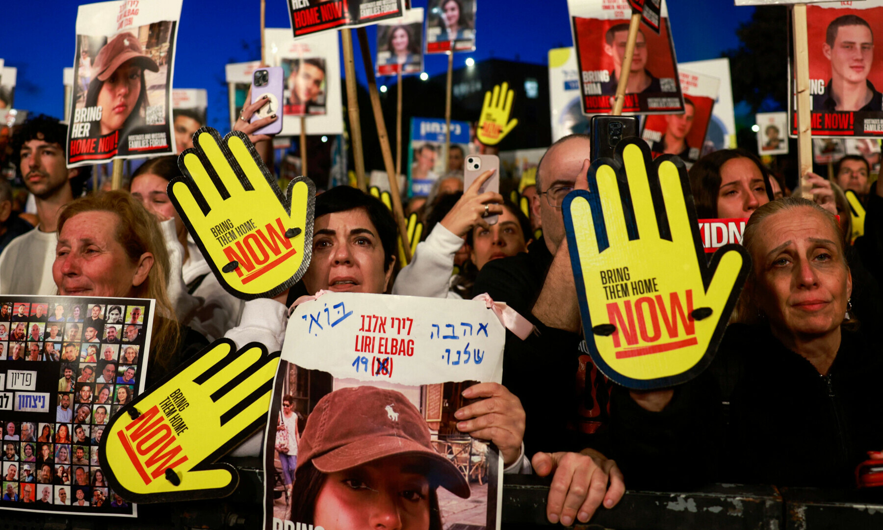  Relatives and supporters of Israeli hostages held in Gaza since Oct 7 attacks by Hamas lift placards during a demonstration in front of the Israeli parliament in Jerusalem on April 7. &mdash; AFP 