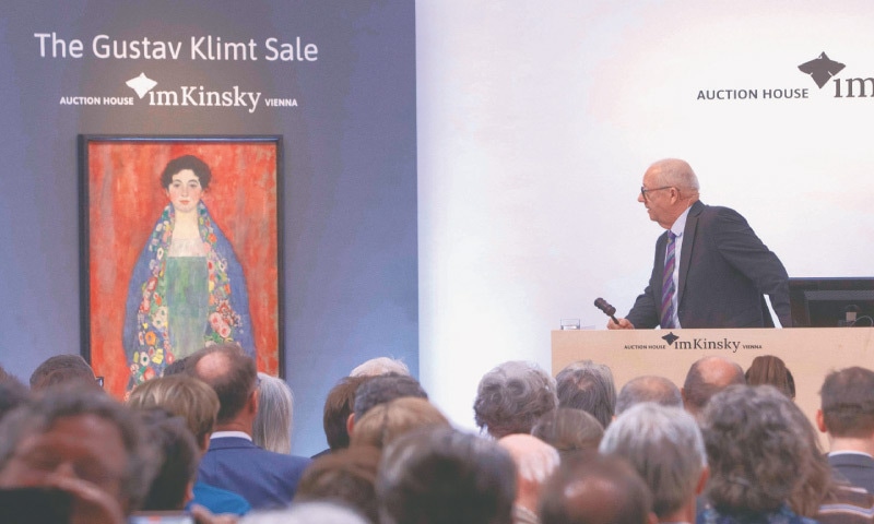 Vienna: Auctioneer Michael Kovacek sells the Gustav Klimt painting, Portrait of Miss Lieser, during auction on Wednesday.—AFP Vienna: Auctioneer Michael Kovacek sells the Gustav Klimt painting, Portrait of Miss Lieser, during auction on Wednesday.—AFP