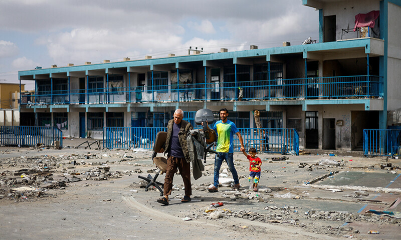 Displaced Palestinians sheltering in a school prepare to flee Rafah after Israeli forces launched a ground and air operation in the eastern part of the southern Gaza City in the southern Gaza Strip on May 13. &mdash; Reuters