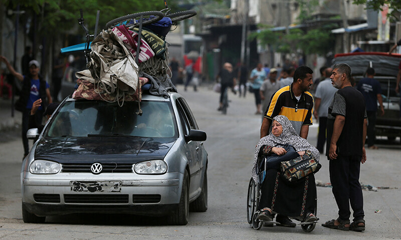 Palestinians travel in vehicles and on foot along with their belongings as they flee Rafah due to an Israeli military operation on May 28. &mdash; Reuters