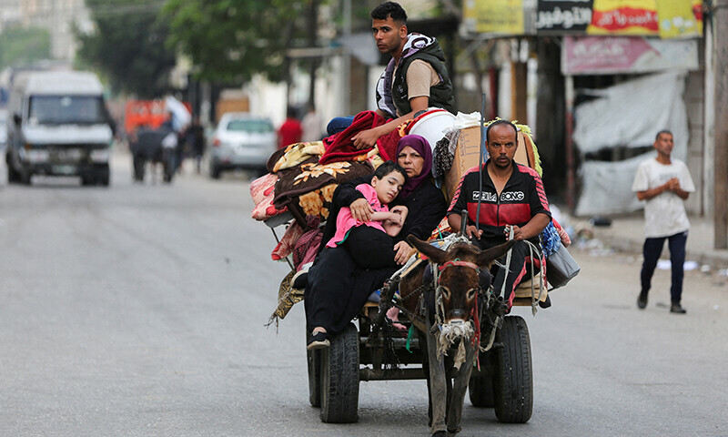 Palestinians travel in a donkey-drawn cart loaded with their belongings as they flee Rafah due to an Israeli military operation on May 28. &mdash; Reuters