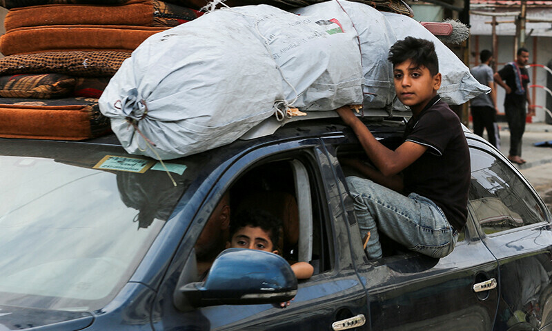 Palestinians travel in a vehicle loaded with their belongings as they flee Rafah due to an Israeli military operation on May 28. &mdash; Reuters