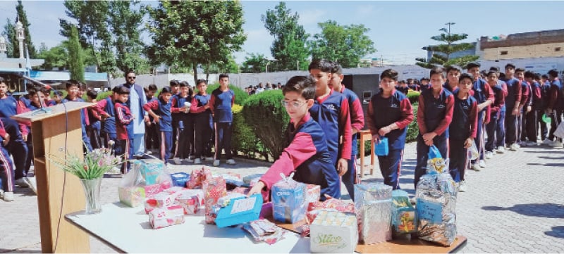Students donate gifts for children suffering from thalassaemia at a school in Swat. &mdash; Dawn