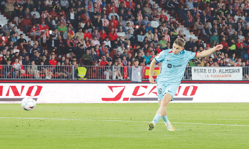 ALMERIA: Barcelona’s Fermin Lopez shoots to score against Almeria during their La Liga match at Estadio de los Juegos Mediterraneos.—Reuters ALMERIA: Barcelona’s Fermin Lopez shoots to score against Almeria during their La Liga match at Estadio de los Juegos Mediterraneos.—Reuters