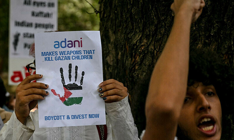 Activists holding placards shout slogans during a demonstration in New Delhi  to express their solidarity with Palestinians on June 1. &mdash; AFP