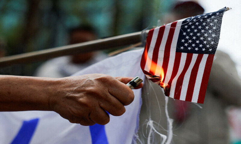 Demonstrators set fire to the flags of Israel and the US during a protest outside the US Embassy in support of Palestinians in Gaza and to condemn the Israeli airstrikes in the southern Gaza Strip city of Rafah in Mexico on June 1, 2024. &mdash; Reuters