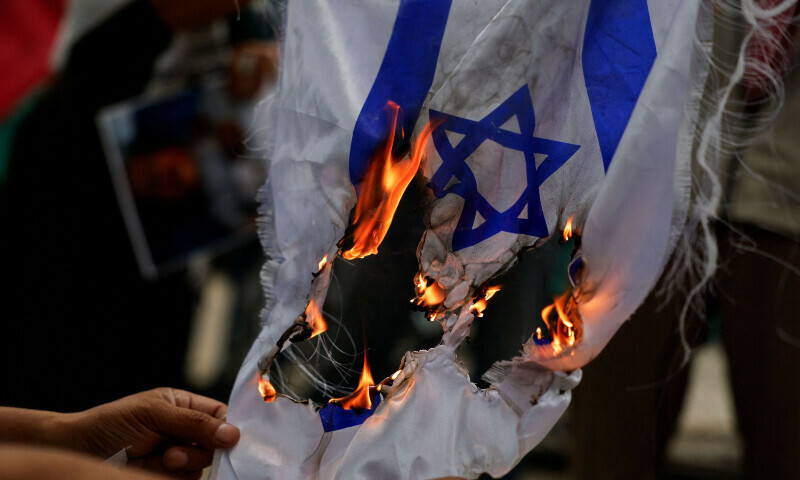 Demonstrators set fire to the flags of Israel and the US during a protest outside the US Embassy in support of Palestinians in Gaza and to condemn the Israeli airstrikes in the southern Gaza Strip city of Rafah in Mexico on June 1, 2024. &mdash; Reuters