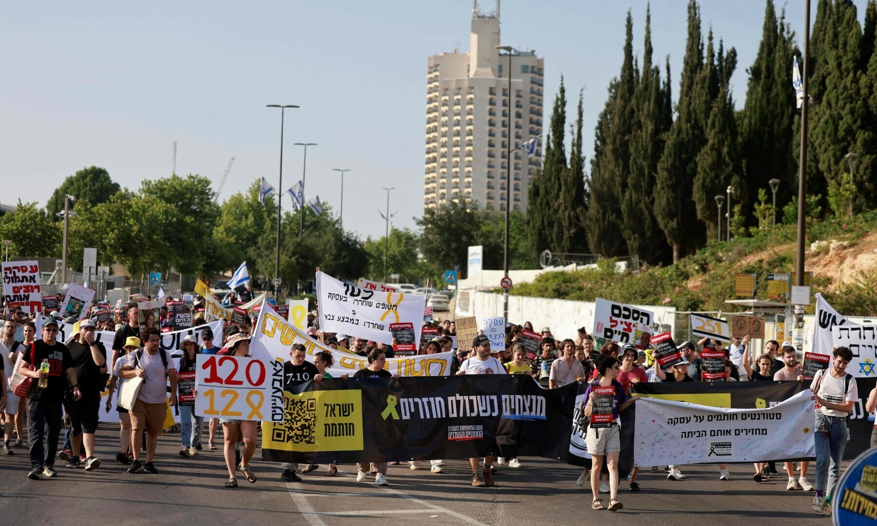 Students holding images of kidnapped Israelis, rally calling on the Israeli government to stop the operation in Gaza and bring back the hostage held by Hamas, outside the Knesset or Israeli Parliament in Jerusalem on June 13, 2024. &mdash; AFP