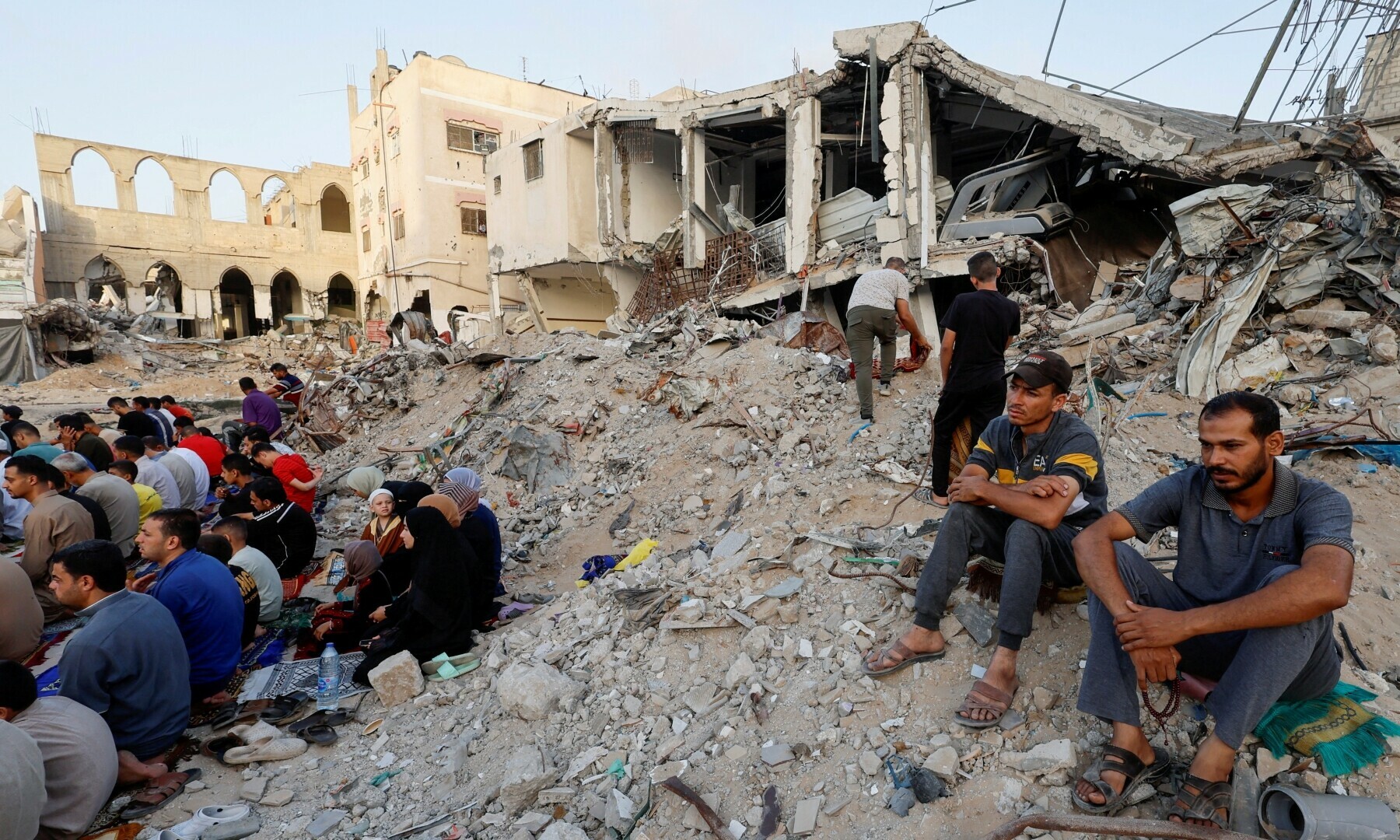  Palestinians hold Eid al-Adha prayers by the ruins of al-Al Rahma mosque destroyed by Israeli air strikes, amid the Israel-Hamas conflict, in Khan Younis, in the southern Gaza Strip on June 16, 2024. &mdash; Reuters 