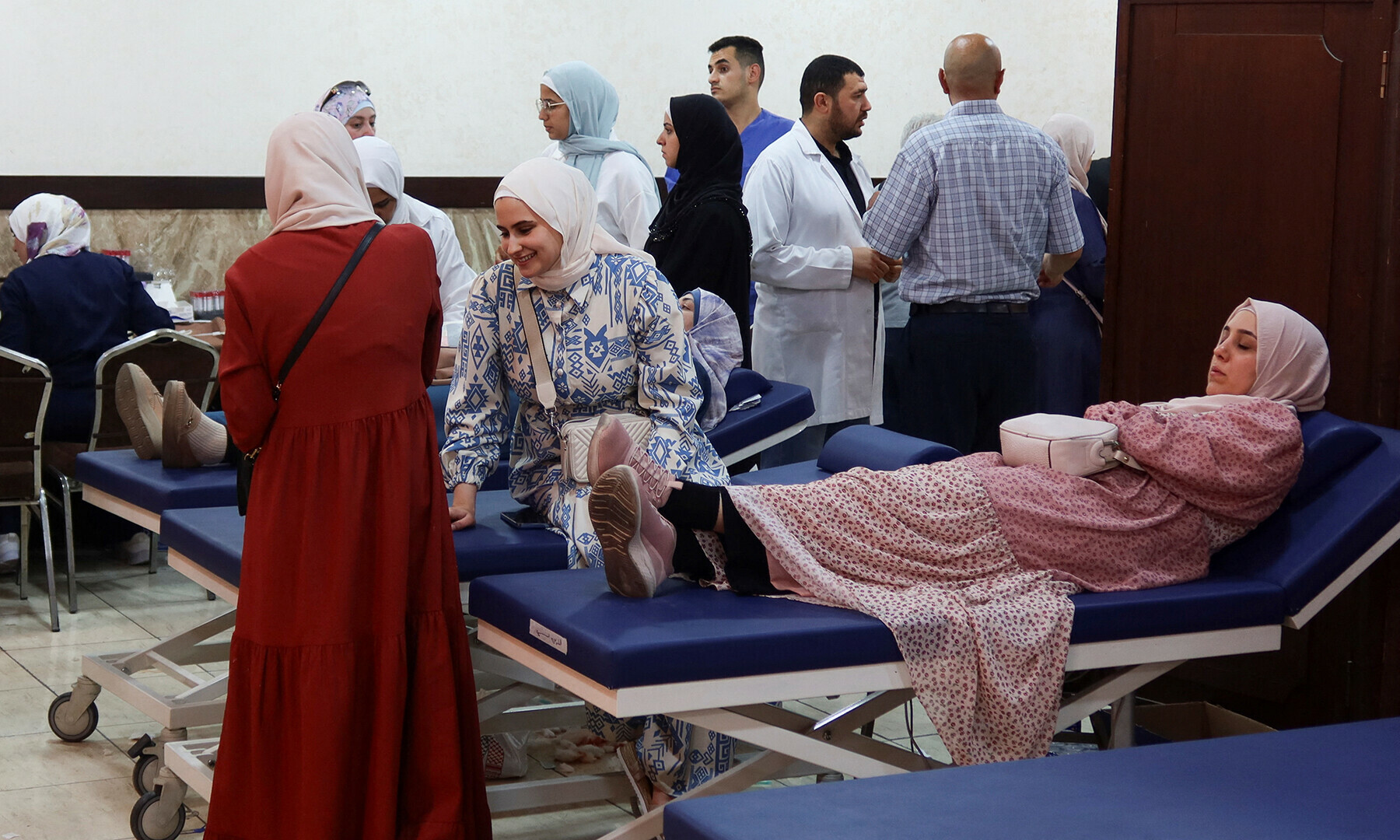 A woman donates blood during a blood donation campaign for Palestinians in Gaza, in Amman, Jordan June 28, 2024.&mdash;Reuters