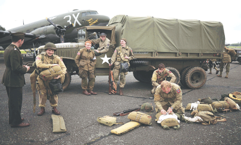 World War II re-enactors prepare their equipment at North Weald airfield in Epping, east of London, in the run-up to celebrations marking the 80th anniversary
of the June 6, 1944, D-Day landings.—AFP World War II re-enactors prepare their equipment at North Weald airfield in Epping, east of London, in the run-up to celebrations marking the 80th anniversary
of the June 6, 1944, D-Day landings.—AFP