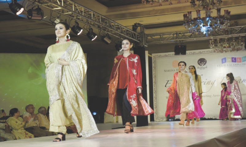 Models walk on the ramp during a fashion show titled &lsquo;Embroidering Dreams&rsquo; in Islamabad on Friday. &mdash; Photo by Tanveer Shahzad