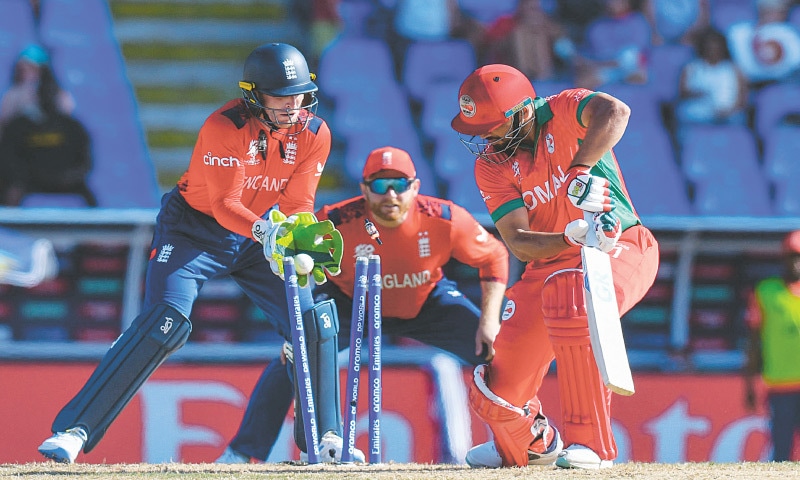 NORTH SOUND: Oman’s Fayyaz Butt is cleaned up by England leg-spinner Adil Rashid during their Group B match at the Sir Vivian Richards Stadium.—AFP