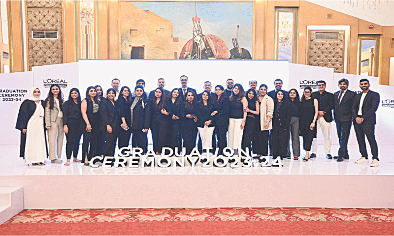 Students celebrate their completion of training at the event.&mdash;Dawn