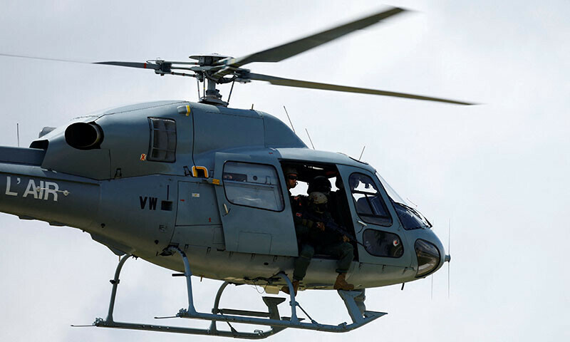 A French Air Force helicopter carrying snipers takes part in a presentation of the drone monitoring operation at the Villacoublay military airport near Paris, France, July 23, 2024. REUTERS/Sarah Meyssonnier