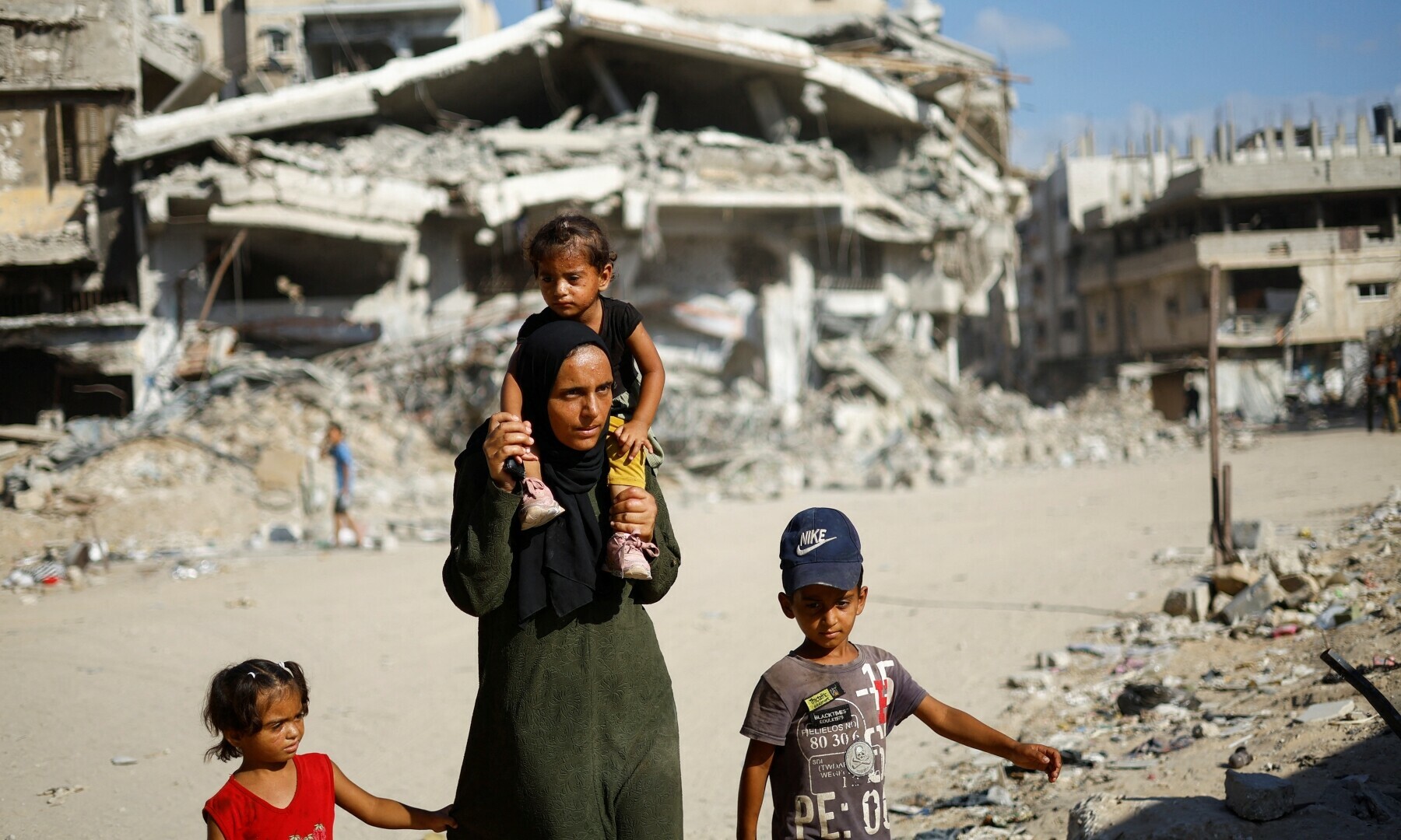  Palestinians make their way to return to neighbourhoods in the eastern side of Khan Younis after Israeli forces pulled out from the area on July 30, 2024. &mdash; Reuters 