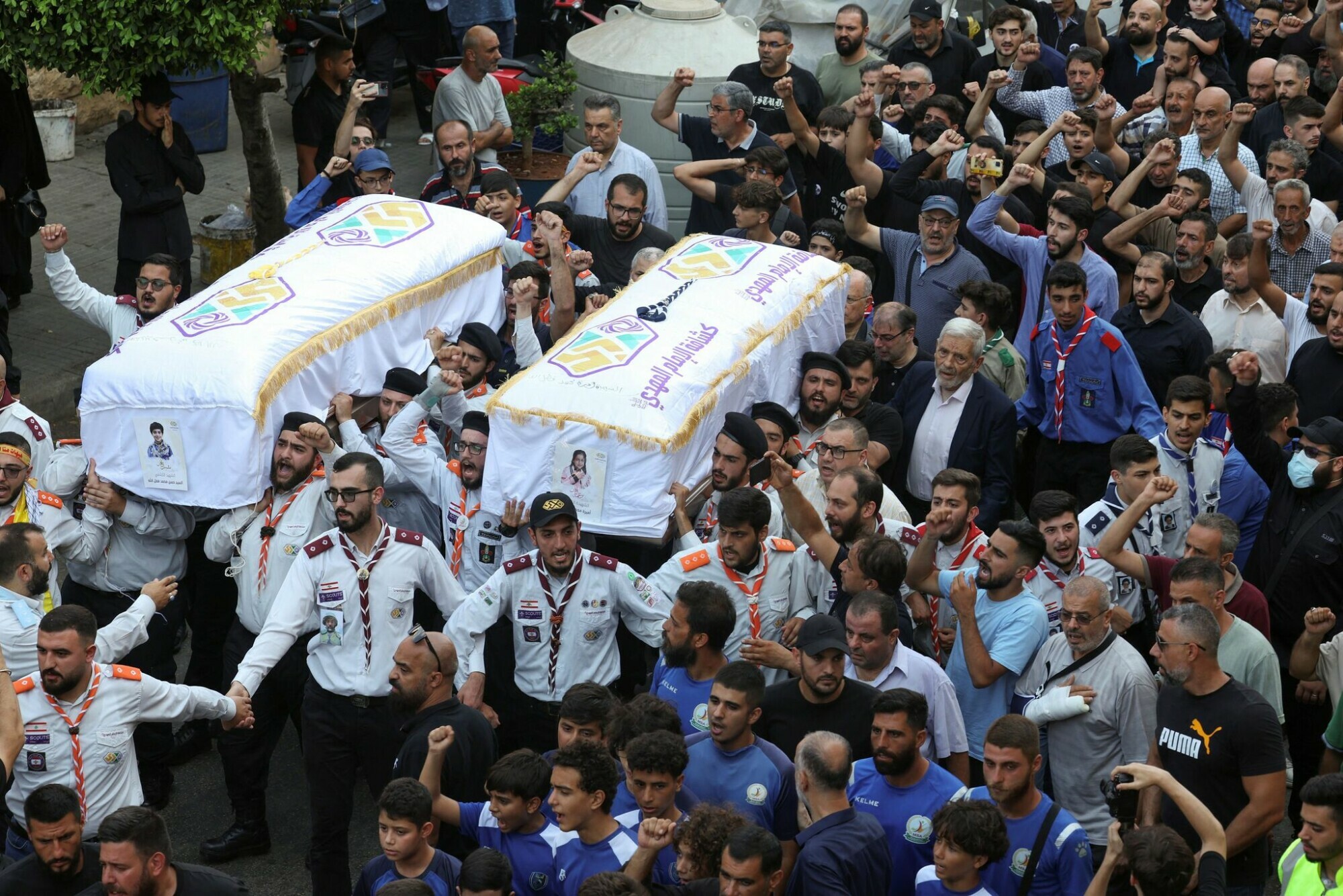  Members of Imam al-Mahdi Scouts carry the coffins of Hassan and Amira Fadlallah, two siblings who were killed by what security sources said was an Israeli strike on Tuesday in Beirut&rsquo;s southern suburbs, in Ghobeiry, Beirut, Lebanon July 31. &mdash; Reuters 