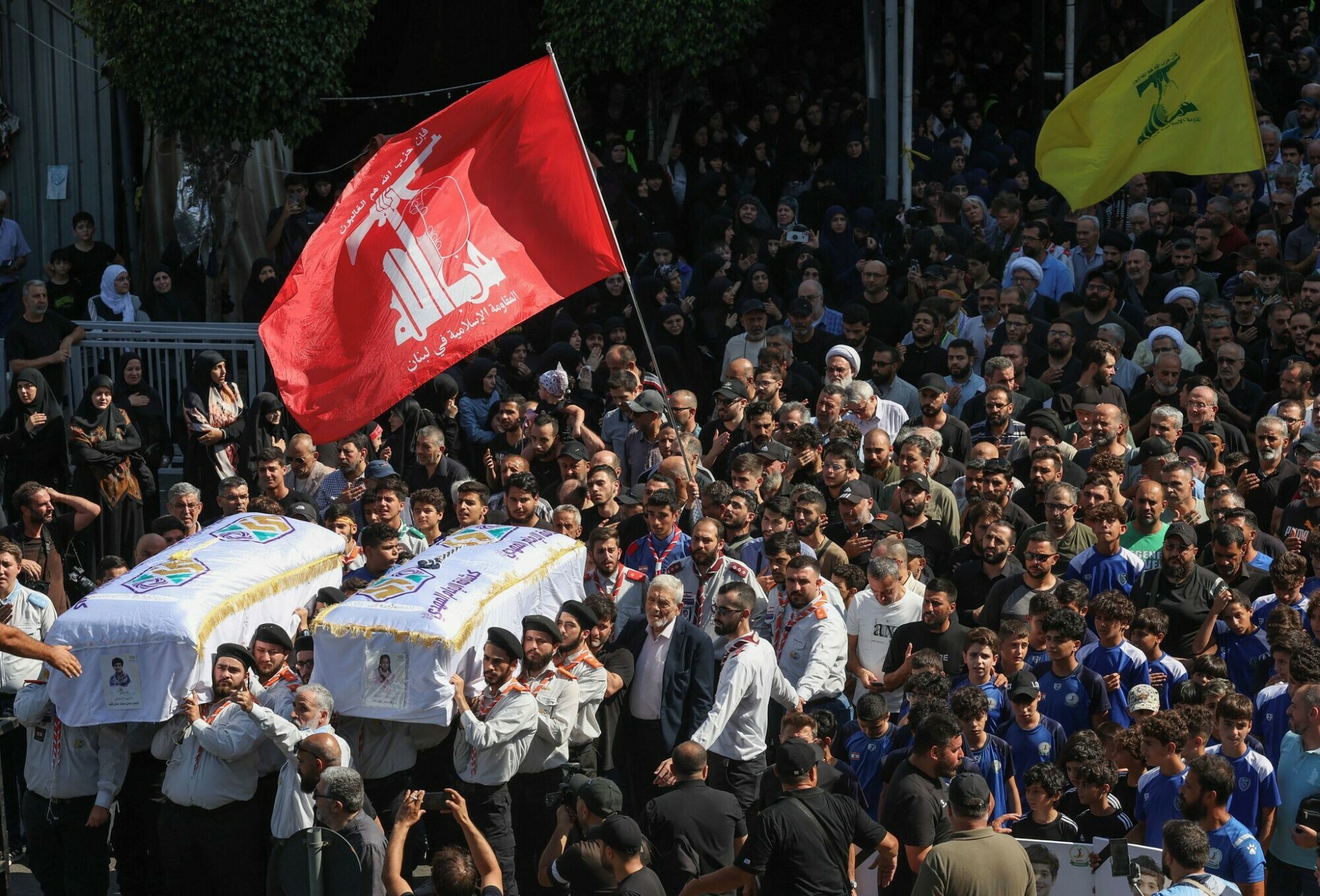 Members of Imam al-Mahdi Scouts carry the coffins of Hassan and Amira Fadlallah, two siblings who were killed by what security sources said was an Israeli strike on Tuesday in Beirut&rsquo;s southern suburbs, in Ghobeiry, Beirut, Lebanon July 31. &mdash; Reuters 