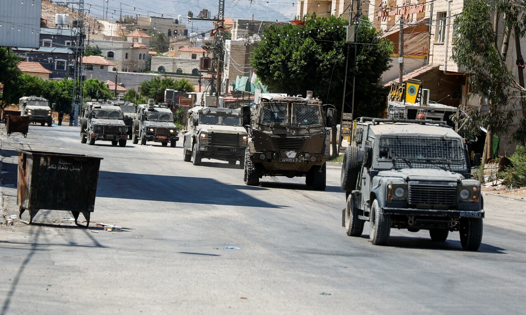  Israeli Military vehicles drive during a raid, in Tubas, in the Israeli-occupied West Bank on Aug 14, 2024. &mdash; Reuters 