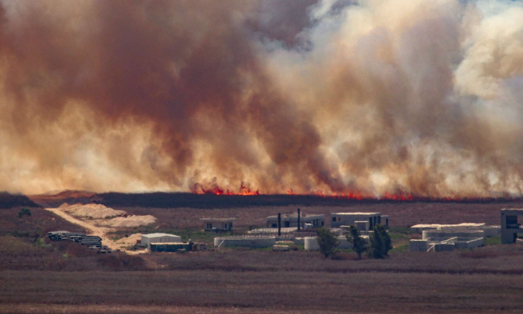  Fire sweeps over the Marjayoun plain in southern Lebanon near the border with Israel after being hit by Israeli shelling on Aug 16, 2024. &mdash; AFP 