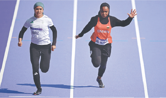 PAKISTAN&rsquo;S Faiqa Riaz and Mazoon Al Alawi of Oman in action during the heats of the women&rsquo;s 100m preliminary round at Stade de France on Friday.&mdash;Reuters