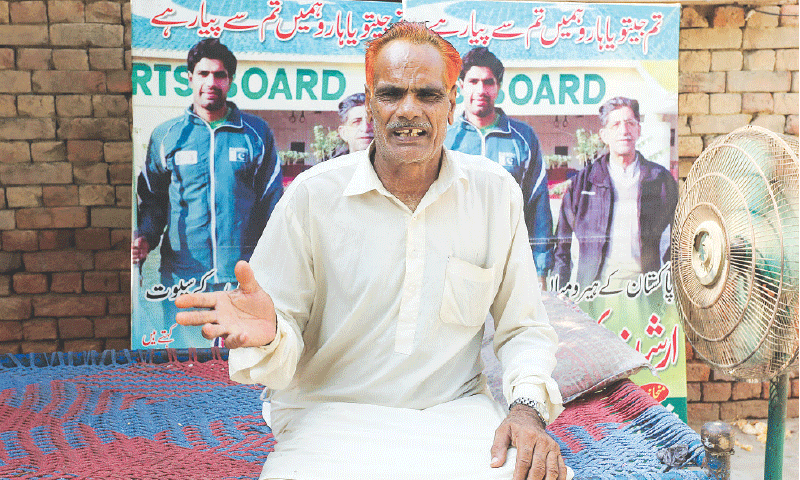 MIAN CHANNU: Mohammad Ashraf, the father of Pakistan&rsquo;s Olympic gold medal-winning javelin thrower Arshad Nadeem, speaks during an interview at his house on Friday.&mdash;AFP