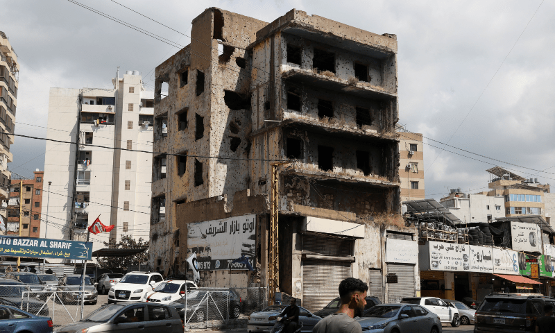  Cars ride past a bullet-riddled building on what was known as the &ldquo;green line&rdquo; in Beirut that divided east and west Beirut, during Lebanon&rsquo;s 1975-1990 Civil war, in Beirut, Lebanon on Sept 2, 2024. &mdash; Reuters/Emilie Madi 