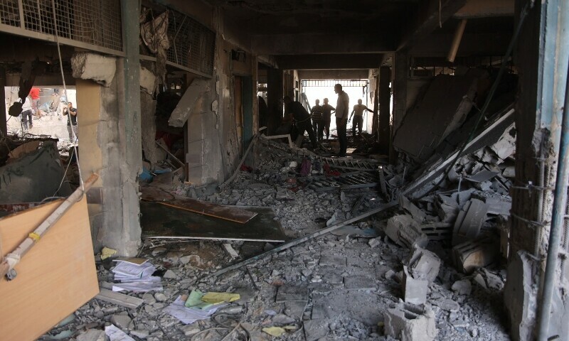 Palestinians inspect the damage at the site of an Israeli strike on a school housing displaced Palestinians in Gaza City&rsquo;s Zaytoun neighbourhood on September 21. &mdash; AFP