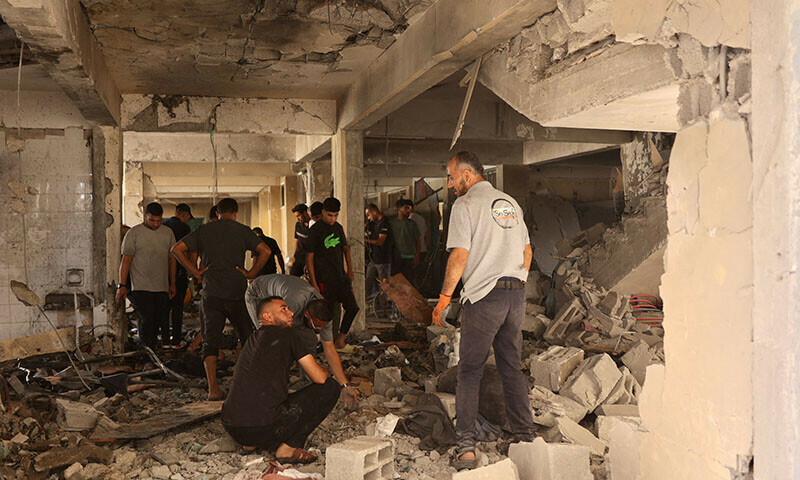 Israeli strike on school housing refugees kills 21