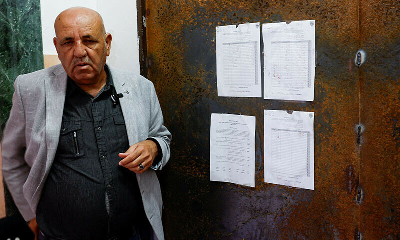 Al Jazeera&rsquo;s local bureau chief Walid al-Omari stands near the entrance to the Al Jazeera office after it was stormed and closed by Israeli forces, in Ramallah, in the Israeli-occupied West Bank, September 22. &mdash; Reuters