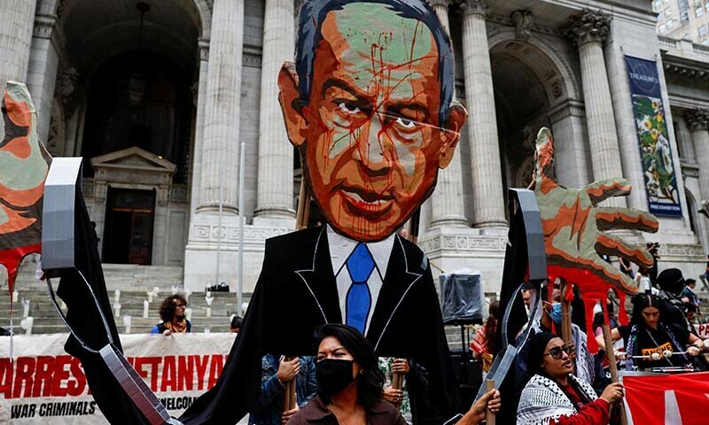 A woman stands near a representation of Israeli PM Benjamin Netanyahu as Pro-Palestinian protesters rally against Israel&rsquo;s strikes on Gaza and Lebanon during demonstrations in New York City, US on Sept 26, 2024. &mdash; Reuters 