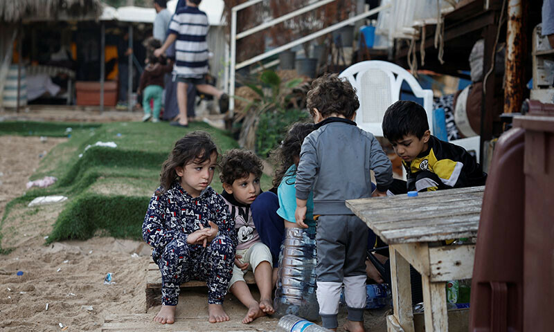 Displaced children play at a makeshift encampment where scores of displaced people live, amid cross-border hostilities between Hezbollah and Israeli forces, at a beach in Beirut, Lebanon on October 1. &mdash; Reuters