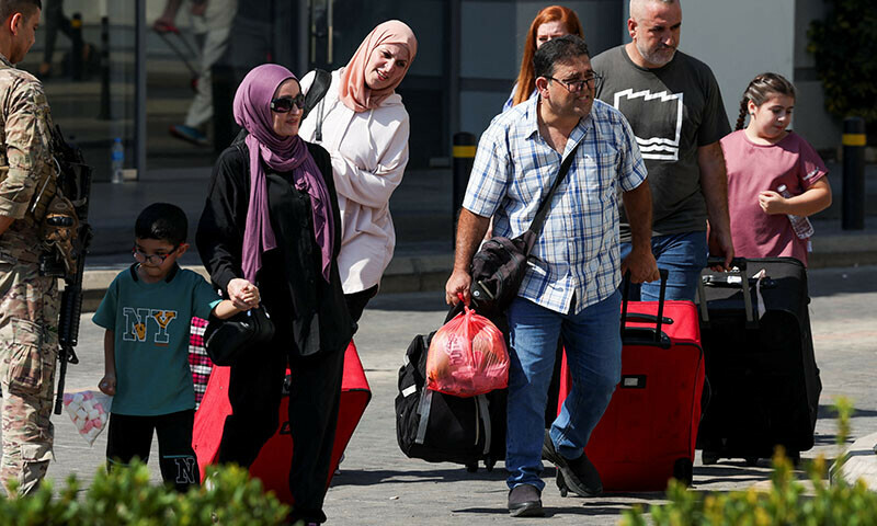 Turkish nationals wait to register for boarding Turkish navy ships to leave Lebanon, amid the ongoing hostilities between Hezbollah and Israeli forces, on October 9. &mdash; Reuters