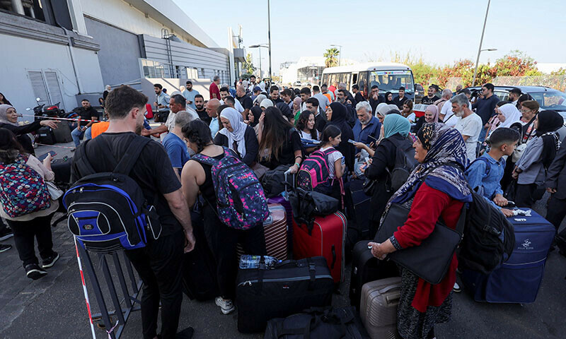 Turkish nationals wait to register for boarding Turkish navy ships to leave Lebanon, amid the ongoing hostilities between Hezbollah and Israeli forces, on October 9. &mdash; Reuters