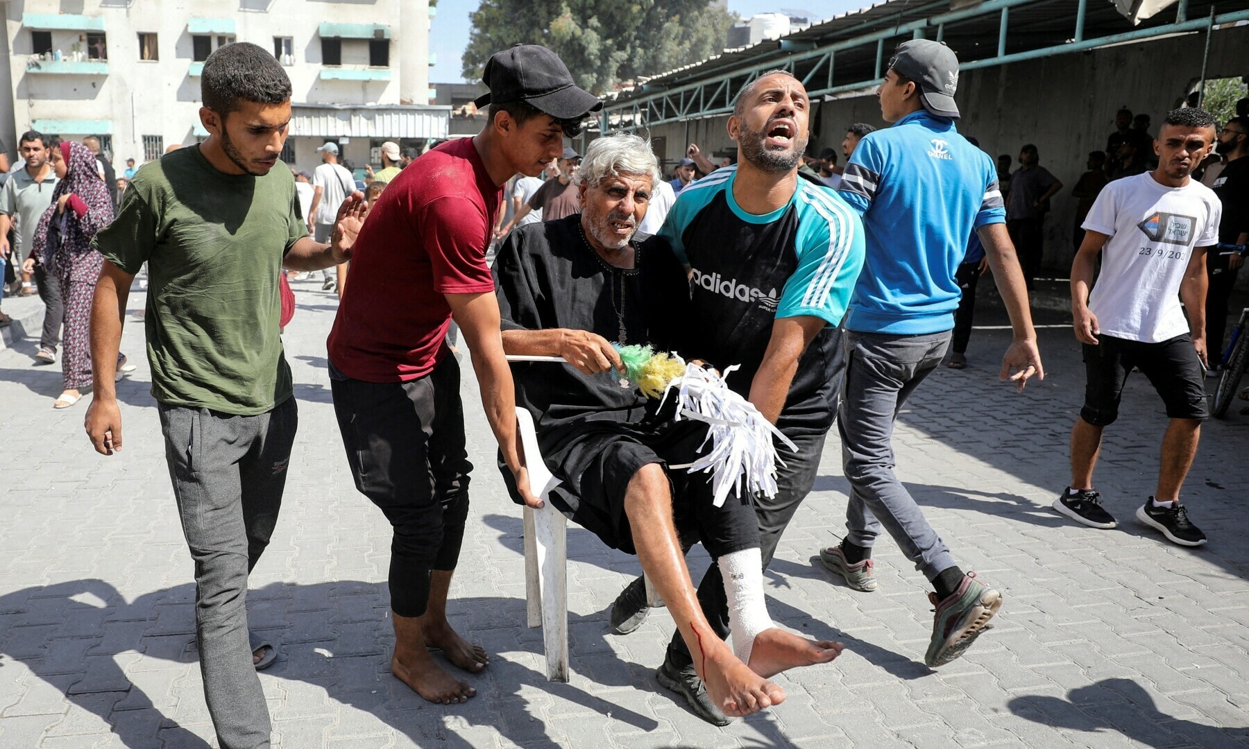 Palestinians carry an injured man in the aftermath of an Israeli strike at al-Remal clinic, which had been sheltering displaced people, in Gaza City on Oct 10, 2024. — Reuters