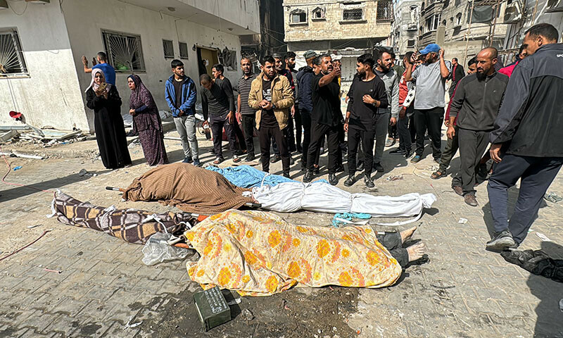 Palestinians mourn over the bodies of relatives at the Kamal Adwan Hospital in Beit Lahia the northern Gaza Strip on October 26, 2024 amid the ongoing war in the Palestinian territory between Israel and Hamas. The health ministry in Hamas-run Gaza accused Israeli forces on October 25, of storming the last functioning hospital in the territory&rsquo;s north in a raid it said left two children dead, while the military told AFP it was unaware of live fire or strikes in the area. (Photo by AFP)