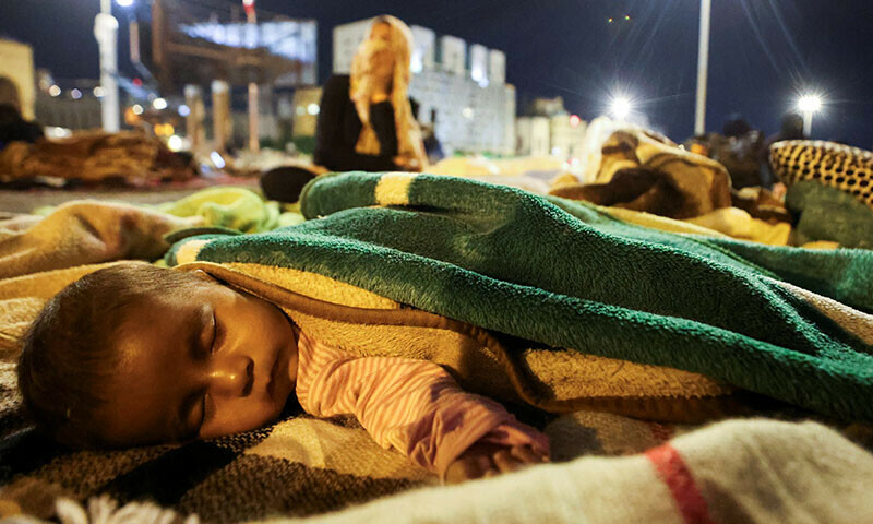 A displaced baby sleeps on the street in Beirut’s central Martyrs’ Square on October 30. — Reuters