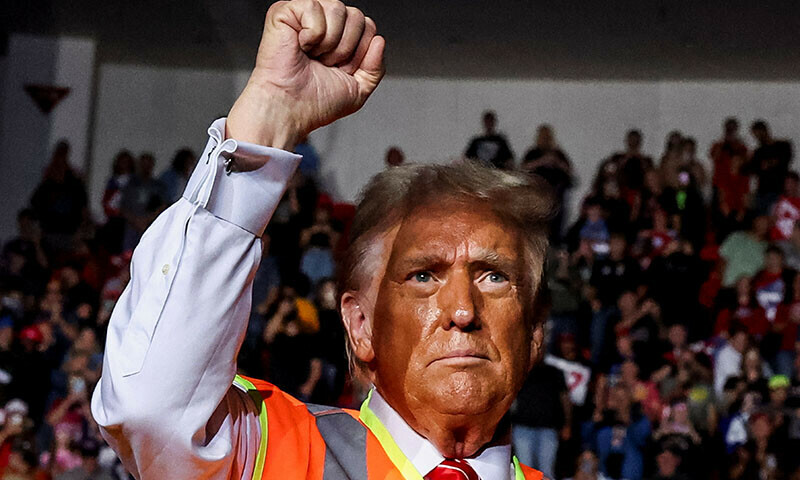 Republican presidential nominee and former US President Donald Trump gestures during his campaign rally, in Green Bay, Wisconsin, US &mdash; Reuters
