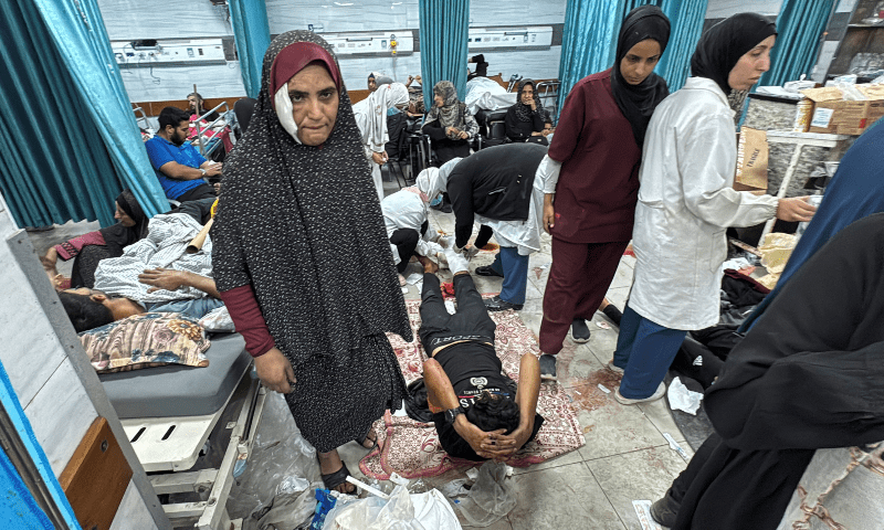  Palestinian casualties lie on beds and the floor at Kamal Adwan hospital after Israeli forces withdrew from the hospital, in Jabalia, in the northern Gaza Strip on Oct 26, 2024. — AFP 