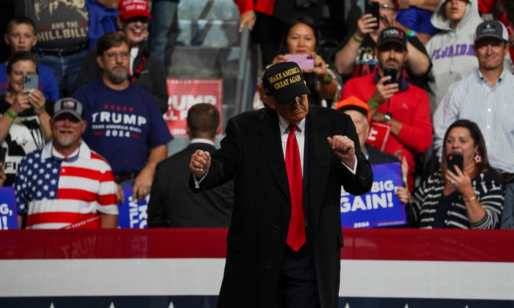  Republican presidential nominee and former US President Donald Trump gestures at a rally at Atrium Health Amphitheater in Macon, Georgia, US on Nov 3, 2024. &mdash; Reuters 